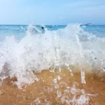 Mesmerizing Close-Up of Waves Crashing on Tioman Island’s Beach