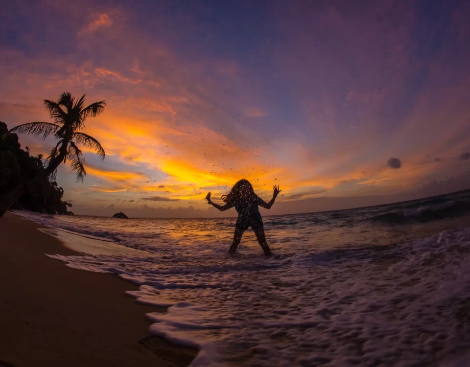 Sunset Bliss on Tioman Island A Girl Splashing Water by the Beach